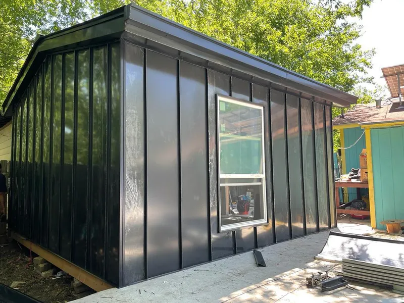 Black standing seam metal wall panels for Metal Roof Installation in Parkville